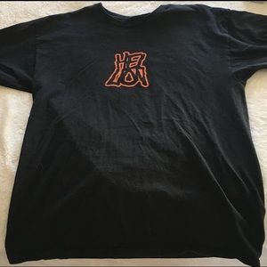 Hell Lion Men’s Tee. Black with orange writing.